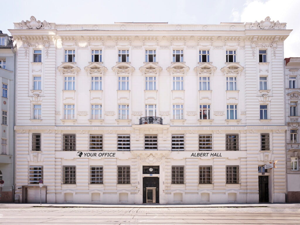 Classic historical white building facade with Your Office and Albert Hall signage