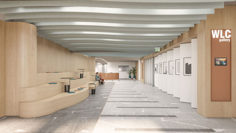 Interior view of YOUR OFFICE at Campus Noricum showing a modern wooden bleacher seating area and the WLC gallery corridor