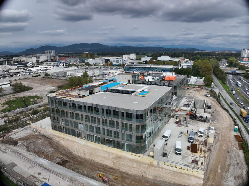 Aerial drone shot showing the construction progress of the YOUR OFFICE Campus Noricum modern office building.