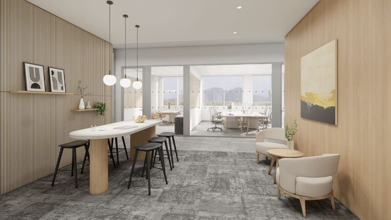 Modern office lounge area with wooden wall paneling, high table, and comfortable seating at Campus Noricum by YOUR OFFICE